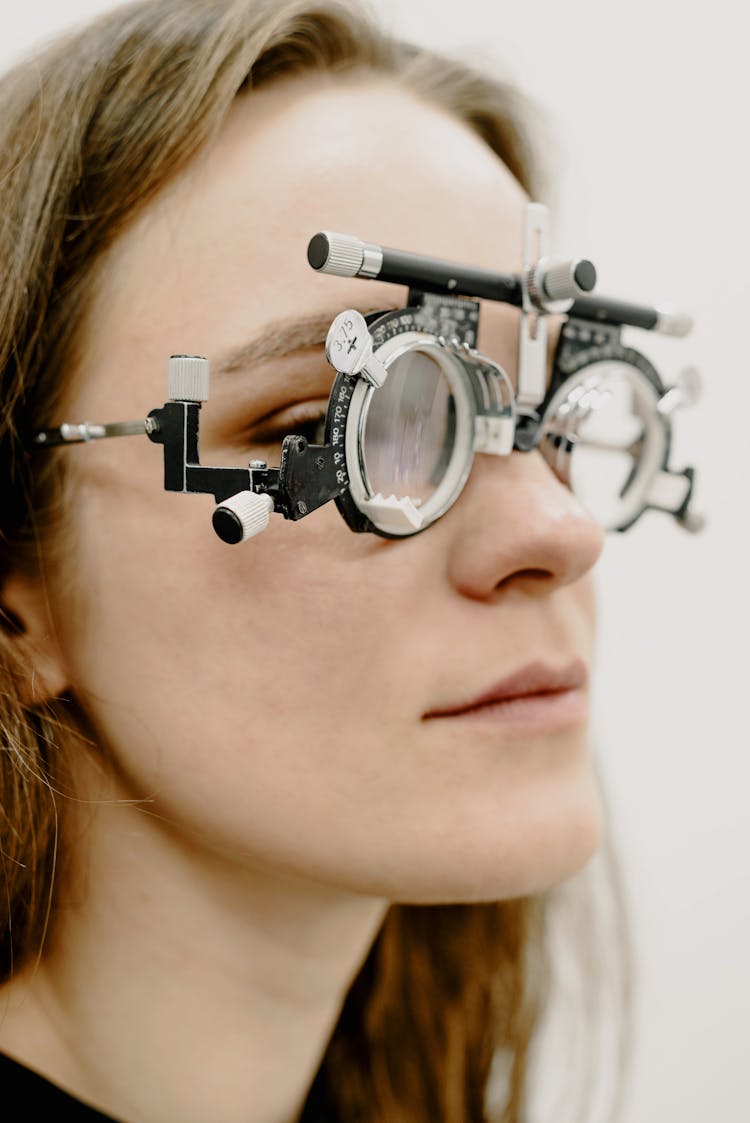 Woman Checking Vision In Medical Glasses