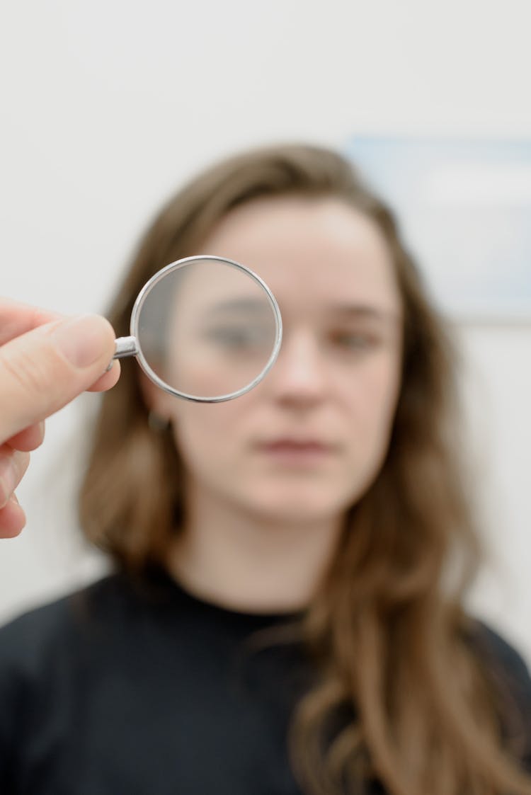 Woman Examining Eyesight In Medical Clinic