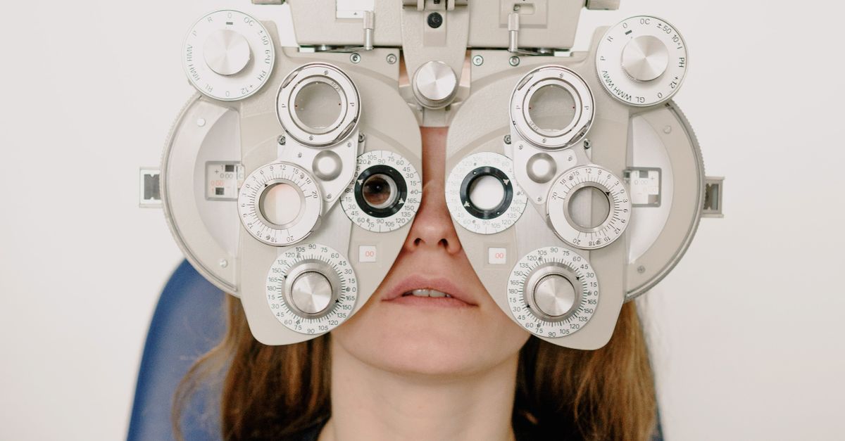 Person reading a book while wearing eyeglasses