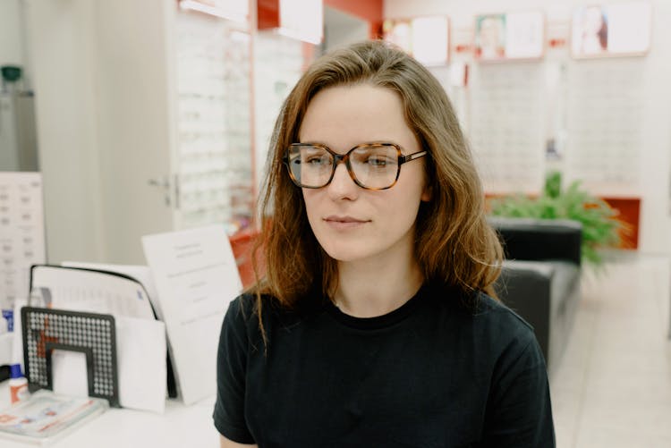 Serious Woman Wearing New Eyeglasses