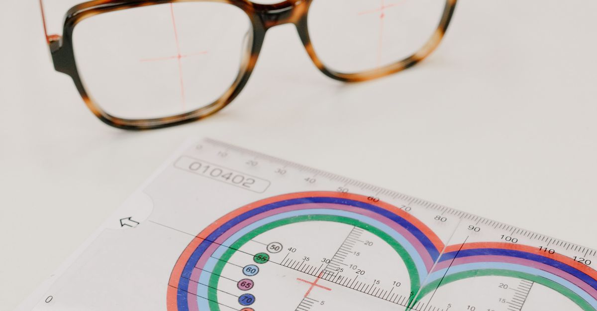 Professional lens ruler near modern eyeglasses on table · Free Stock Photo