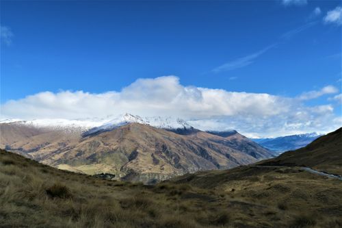 Free Scenic view of snow-capped mountains under a clear blue sky. Stock Photo
