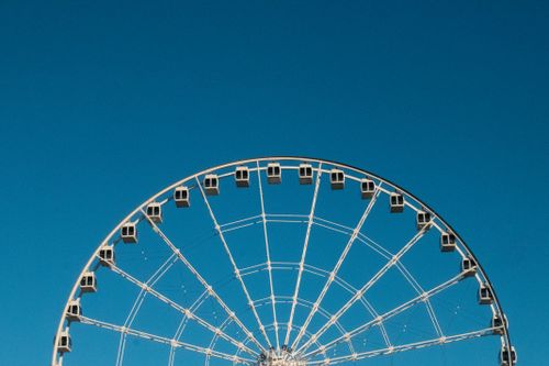 Free A partial view of a Ferris wheel against a clear blue sky in Montreal, Canada. Stock Photo