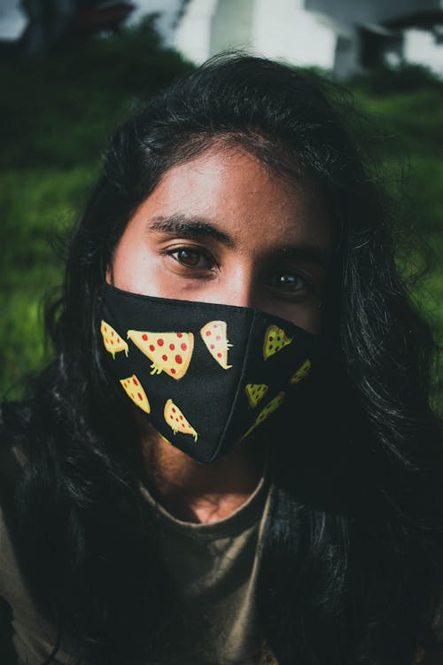Free Close-Up Shot of a Woman with a Black Face Mask Stock Photo