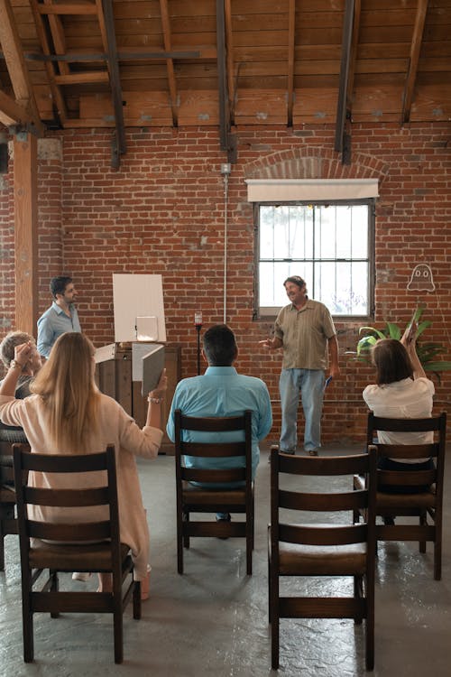 Adult Students Inside a Brick Building