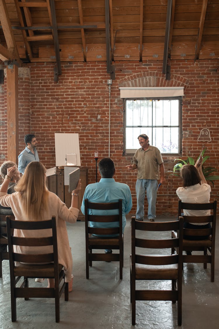 Adult Students Inside A Brick Building