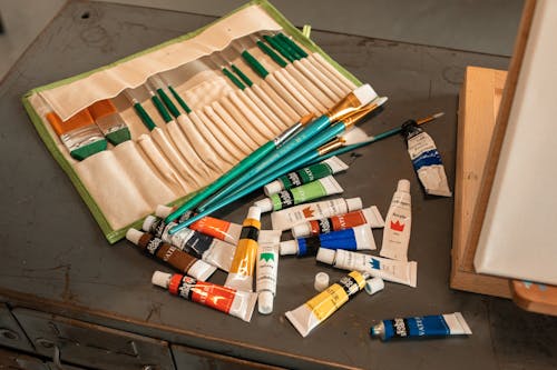 Paints and Brushes on the Desk
