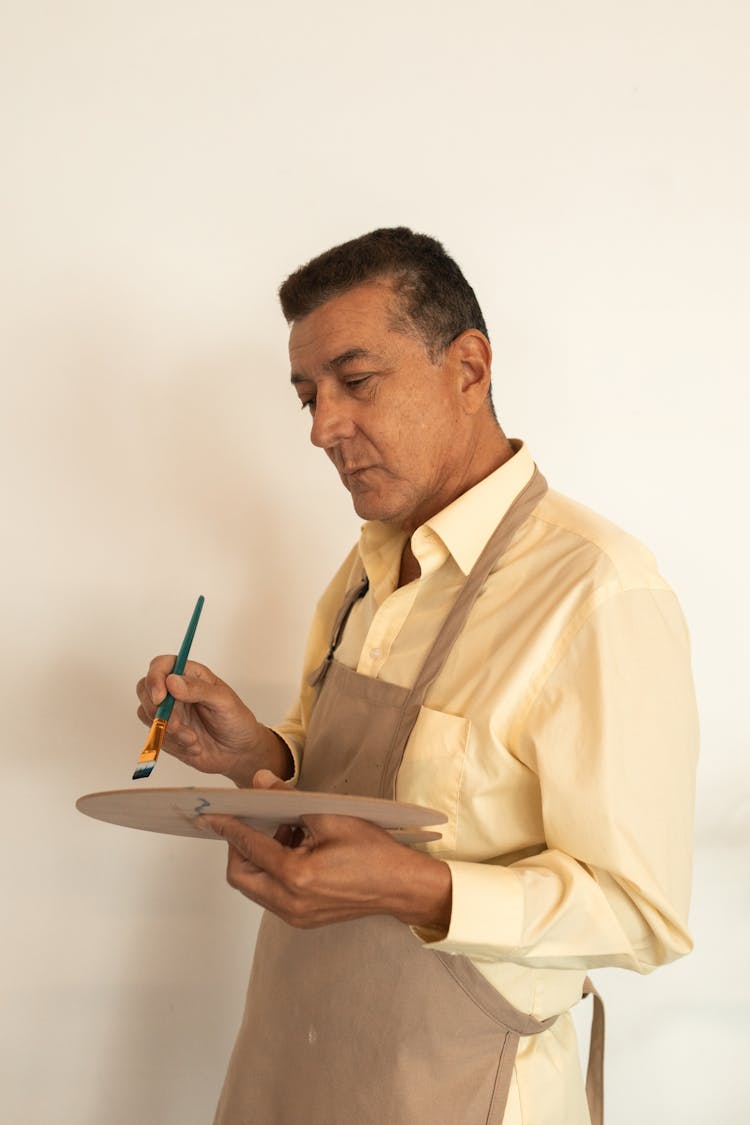 Man Holding A Brush And Palette