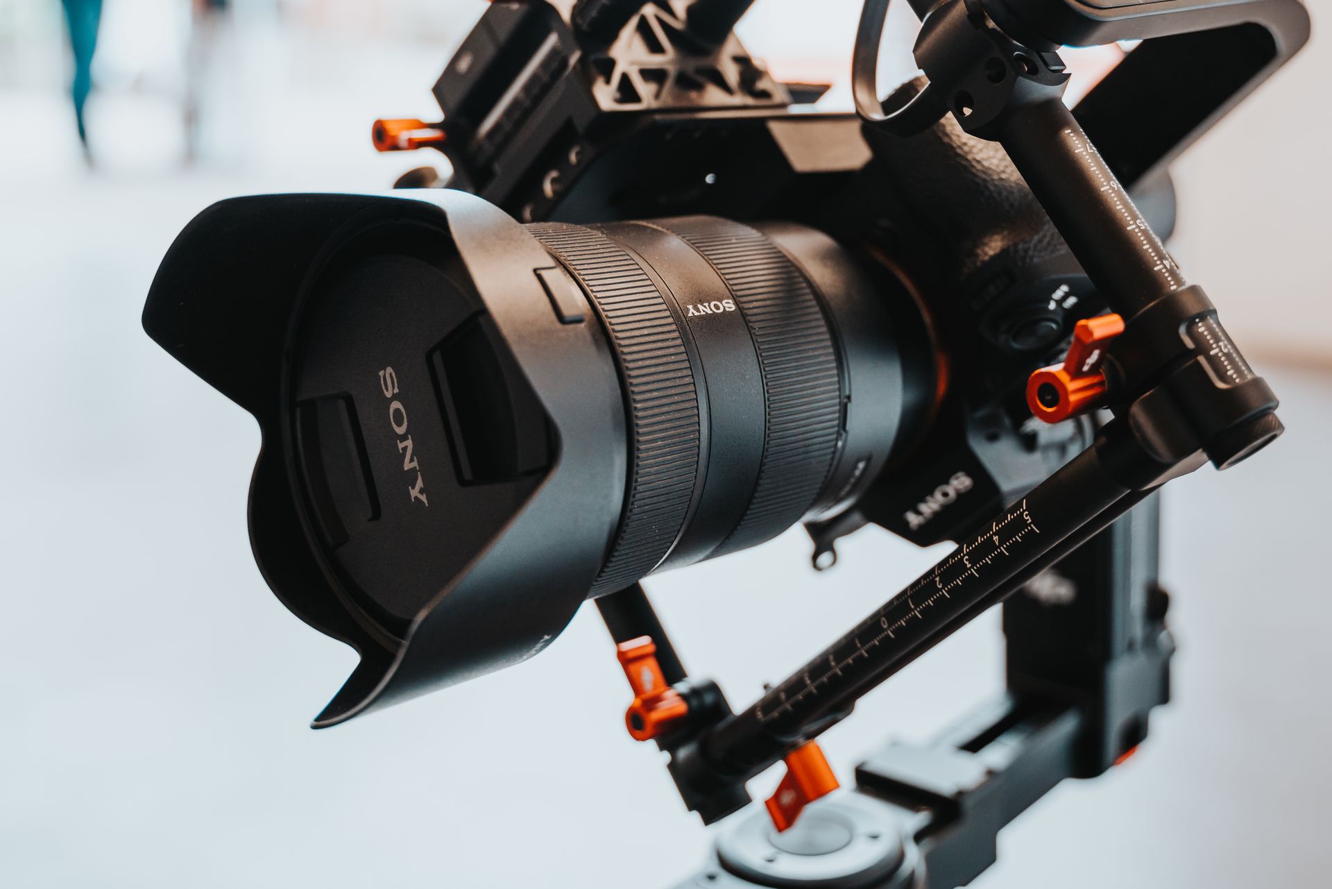 Detailed view of a professional camera rig with lens and gimbal, showcasing modern photography equipment.