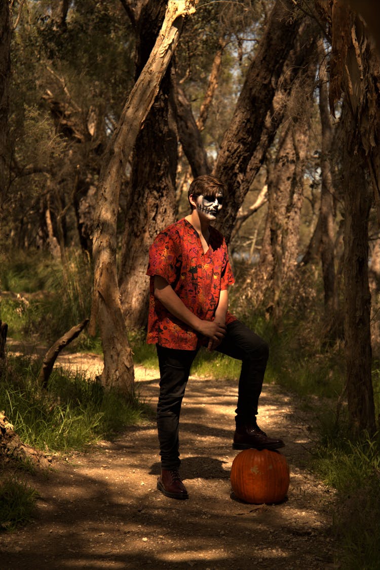 A Man Stepping On A Pumpkin Gourd