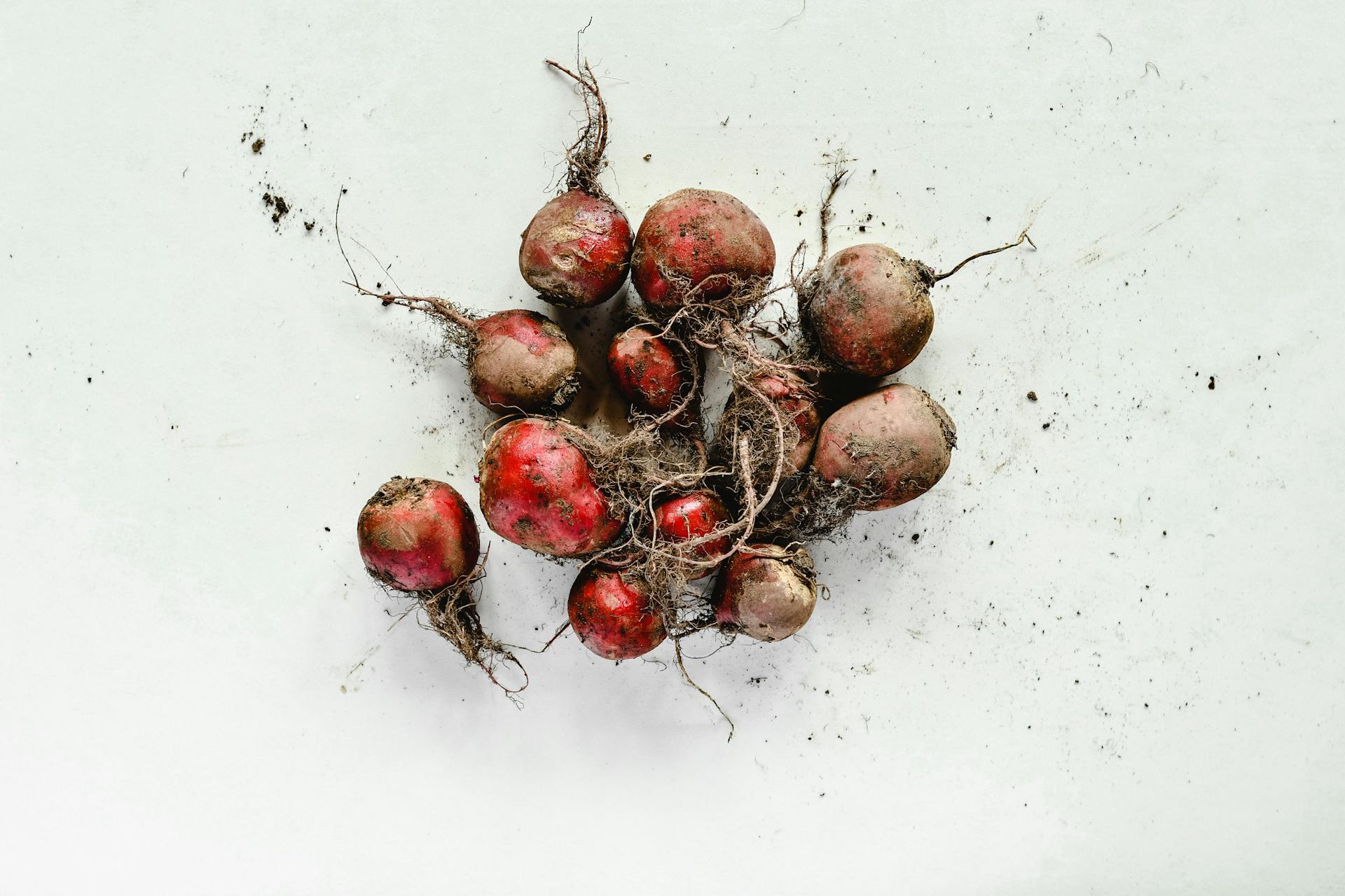 Close-Up Shot of Beetroots on White Surface