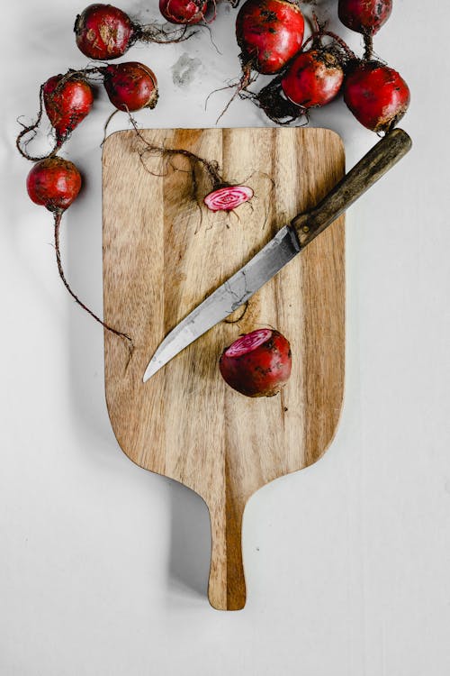 Red Cherries on Brown Wooden Chopping Board