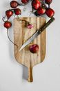 Red Cherries on Brown Wooden Chopping Board