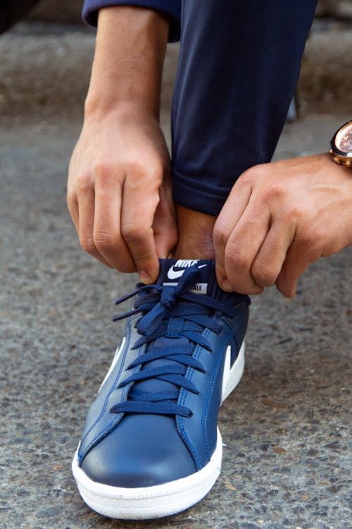Free Person in Blue and White Nike Athletic Shoe Stock Photo