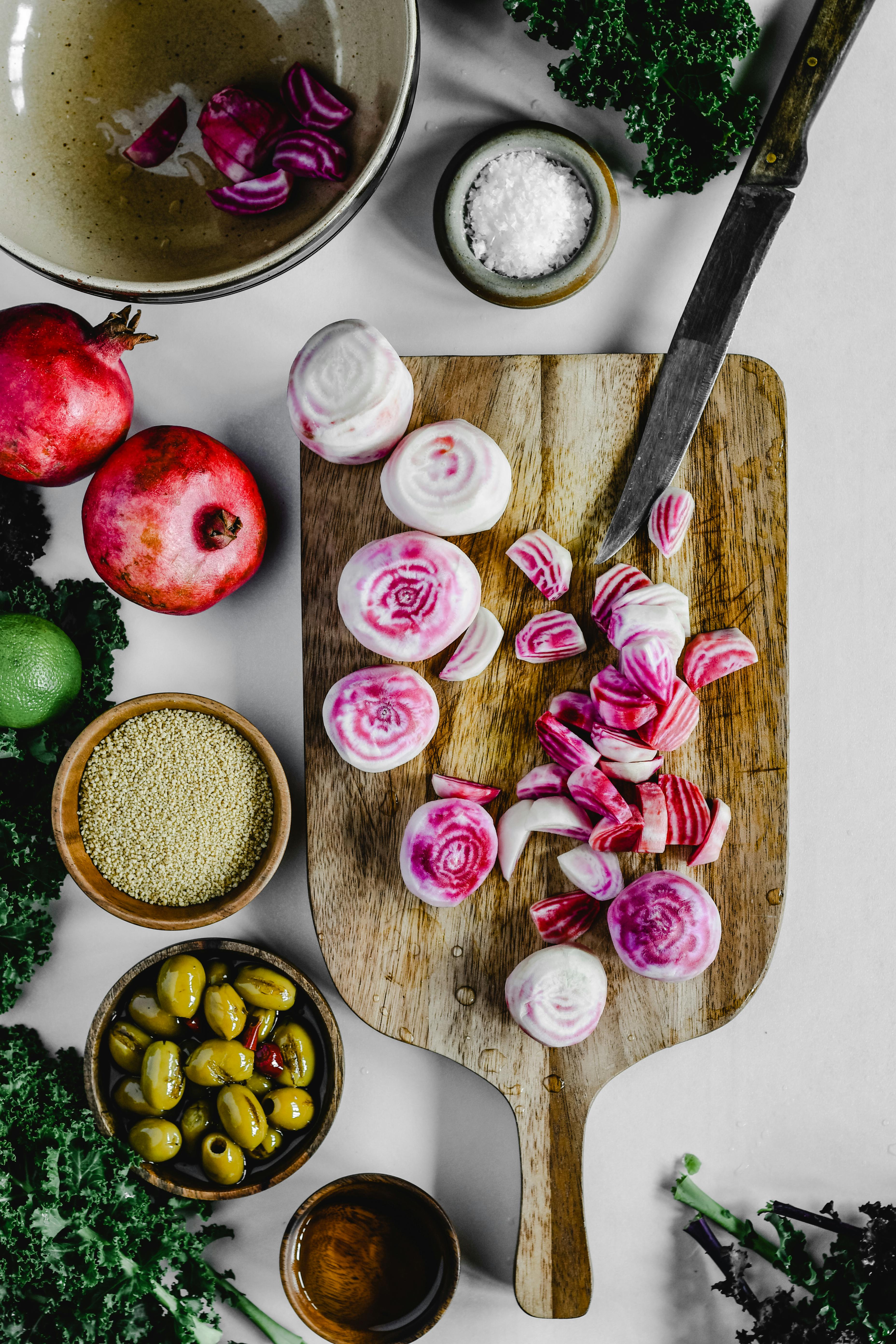 Top view of beetroot and ingredients on a chopping board for a vibrant food preparation scene.
