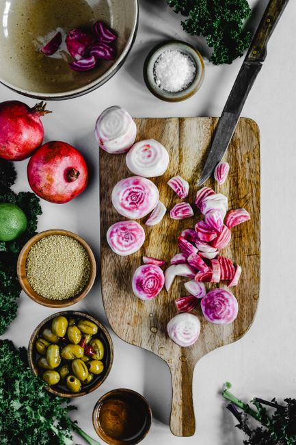 Top view of beetroot and ingredients on a chopping board for a vibrant food preparation scene.