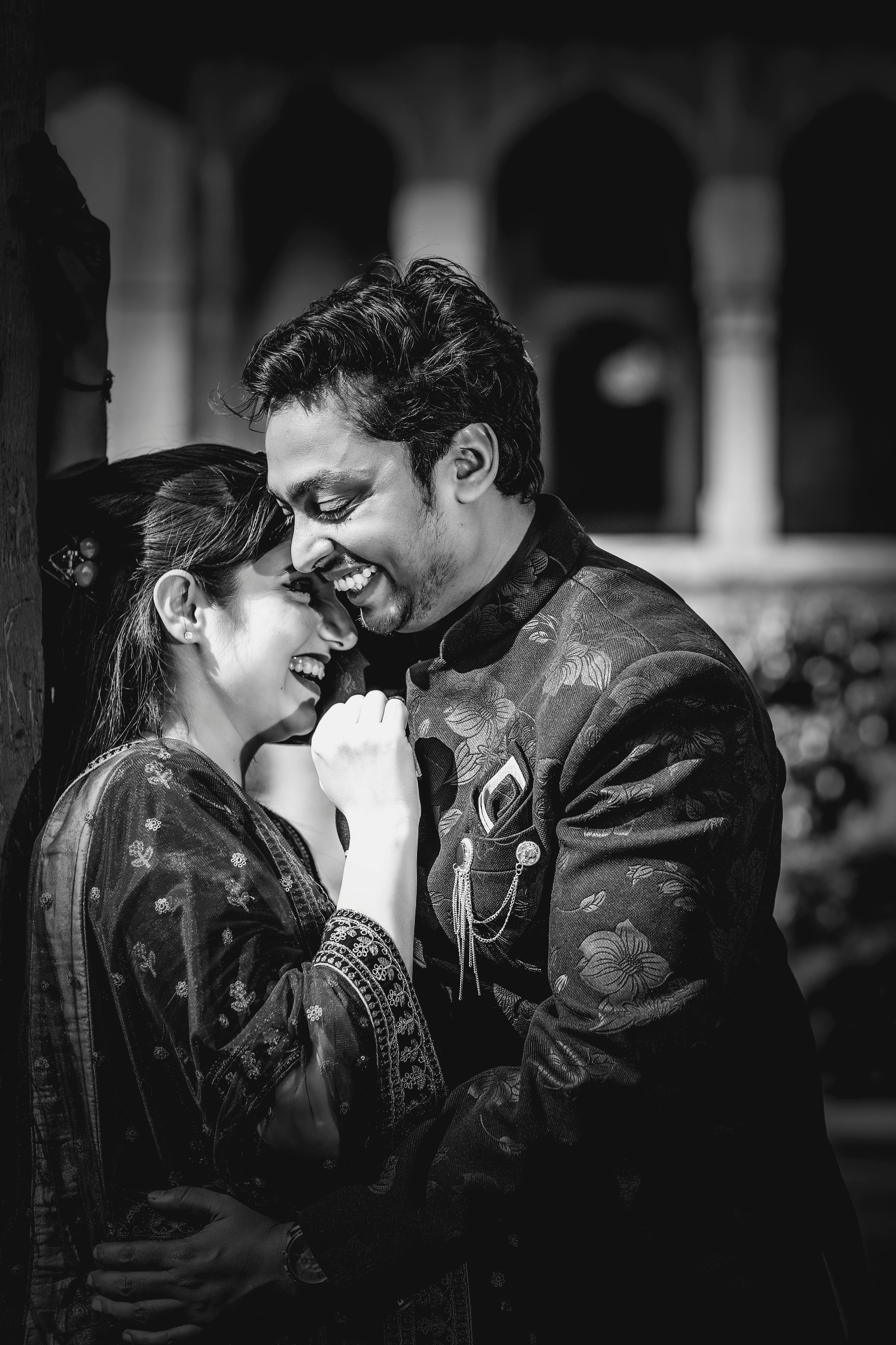 Man and Woman Kissing in Grayscale Photography