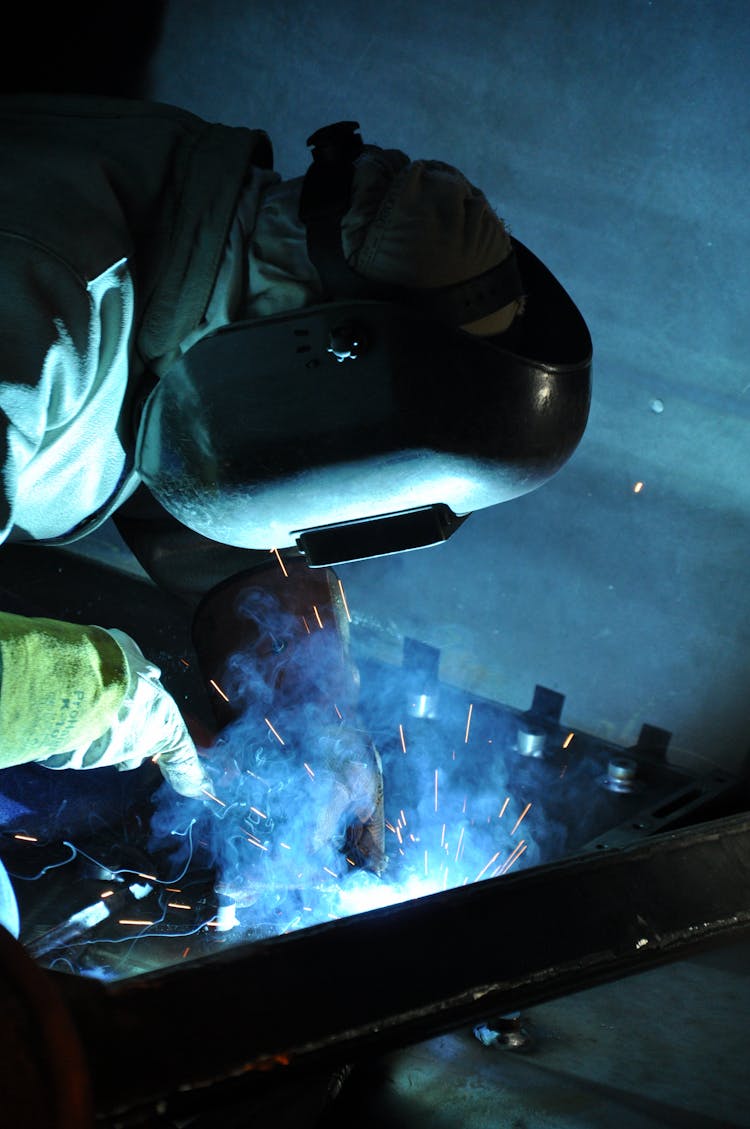 A Man Wearing A Welding Mask