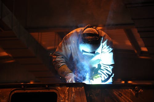 Man Welding in Factory