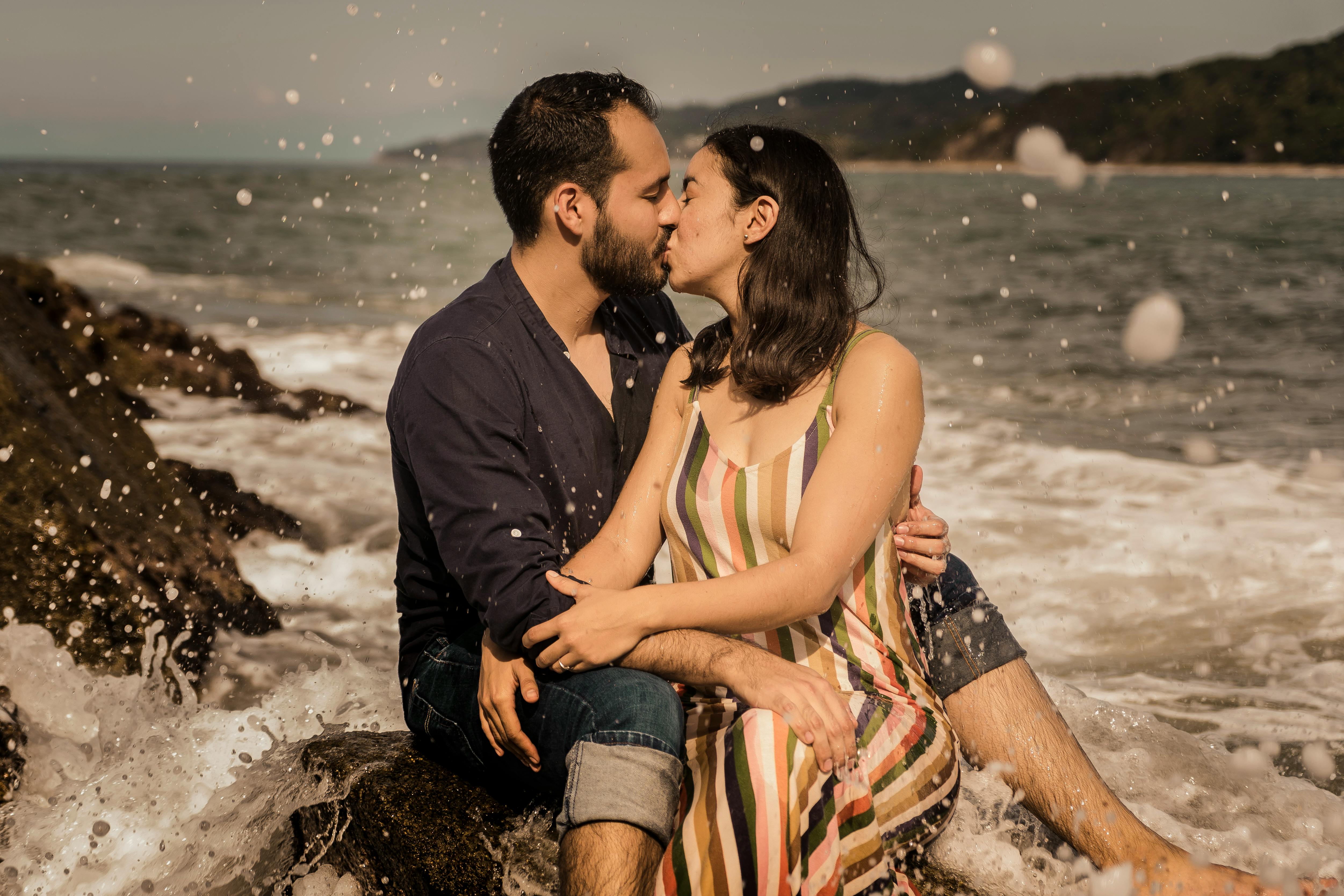 Man and Woman Kissing on Beach · Free Stock Photo