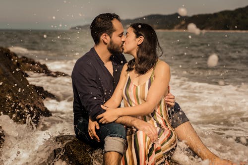 Man and Woman Kissing on Beach