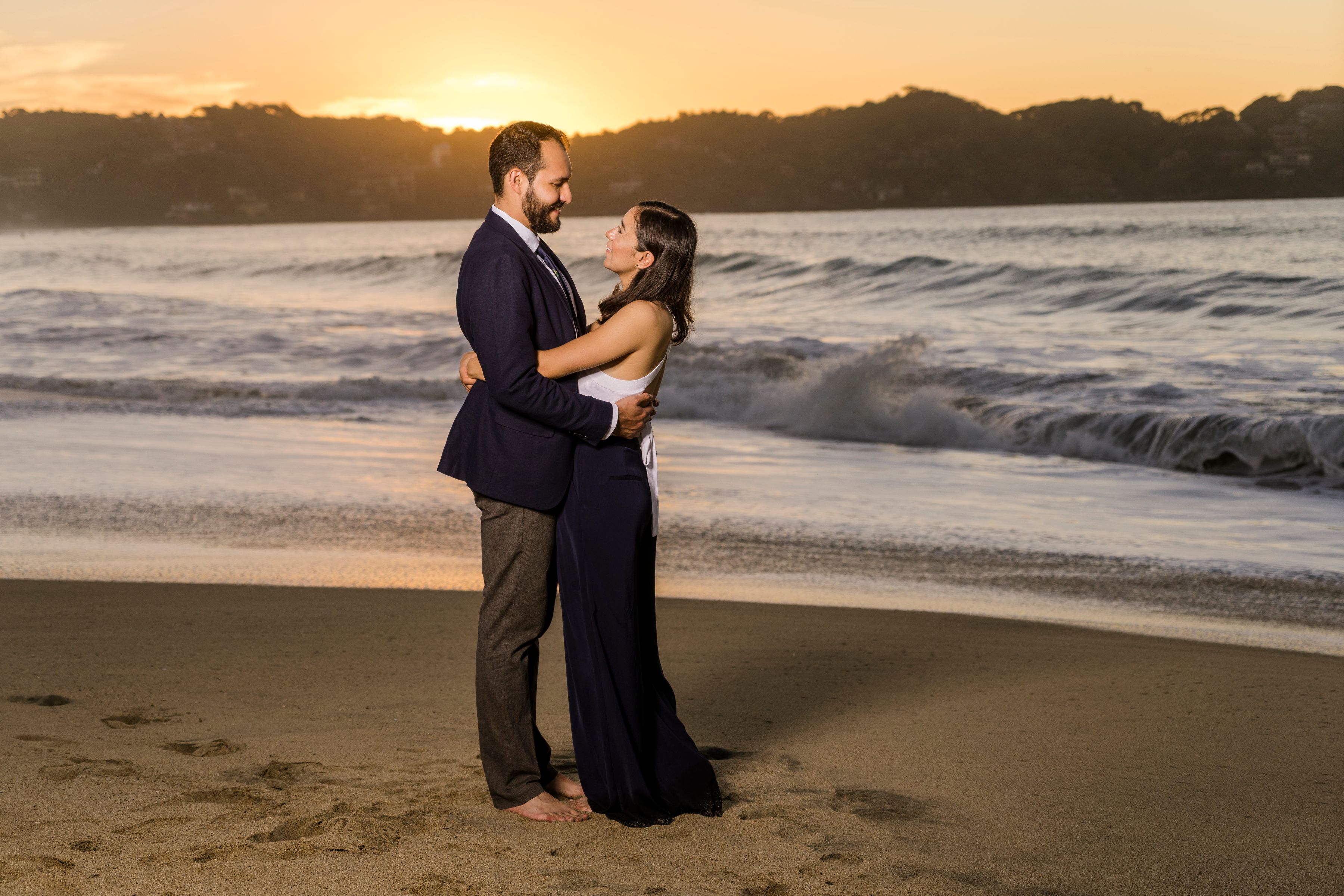 Couple embracing at sunset
