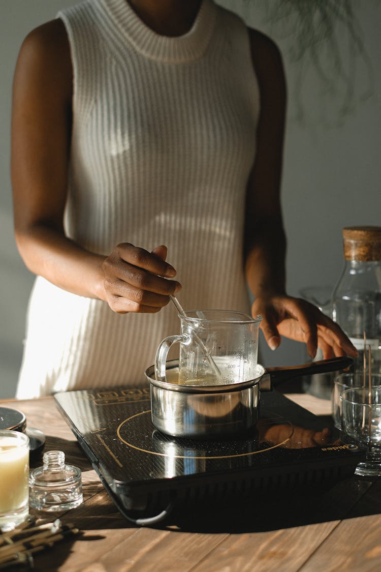 Crop Black Woman Melting Wax