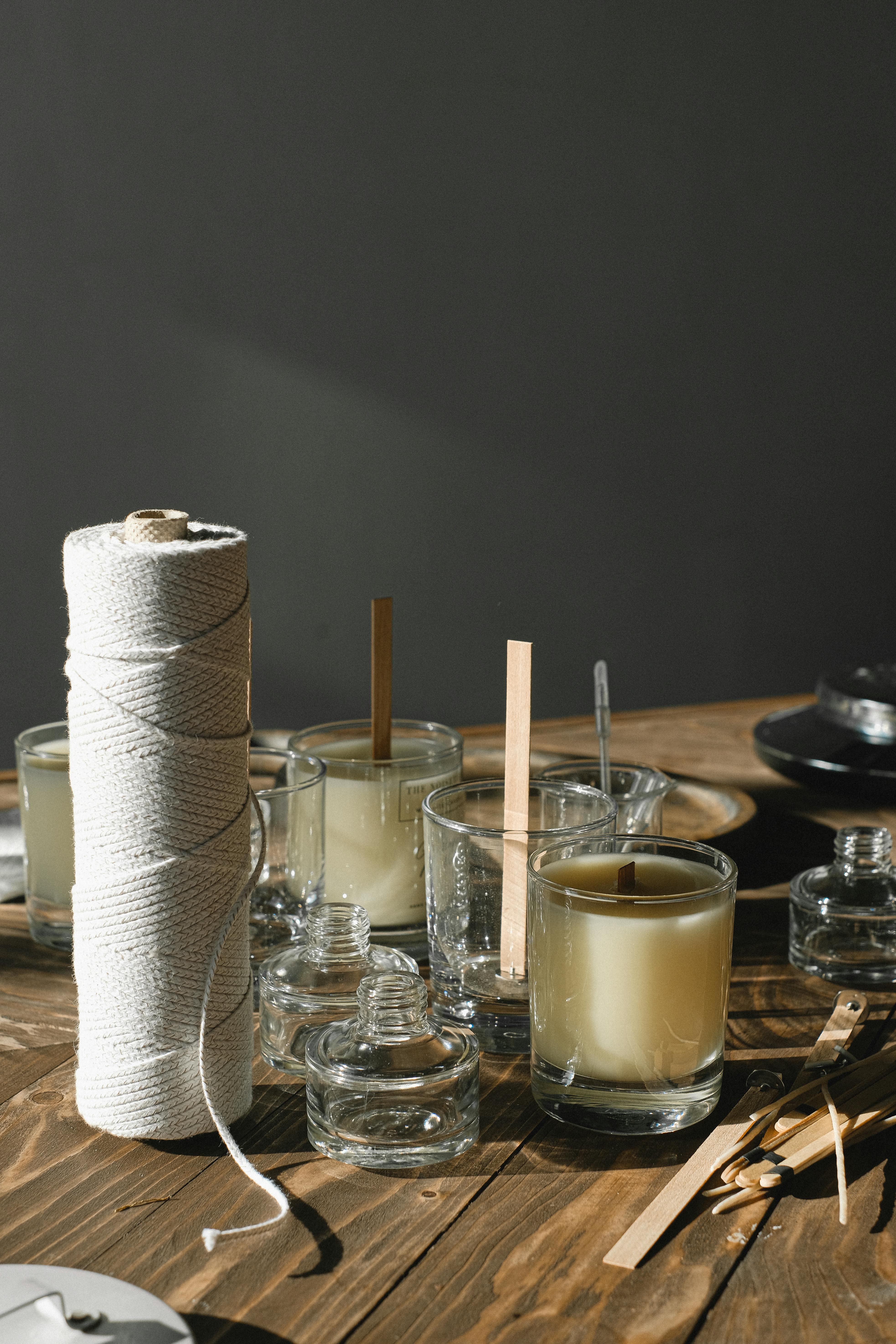 aroma candles with wick on wooden table