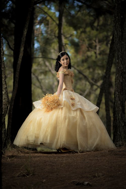 Female Teenager Wearing Her Yellow Ball Gown Free Stock Photo
