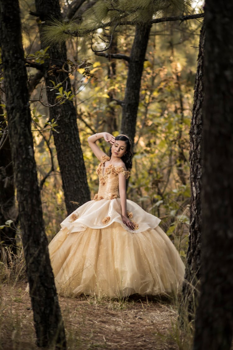 Woman In Yellow Gown Standing