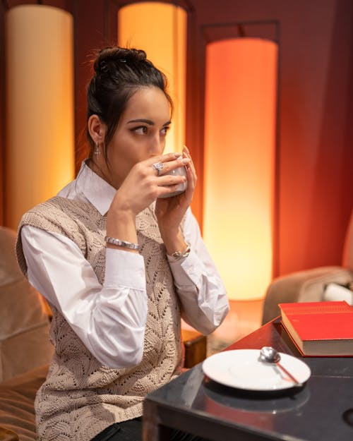 Attractive woman drinking coffee in cafe