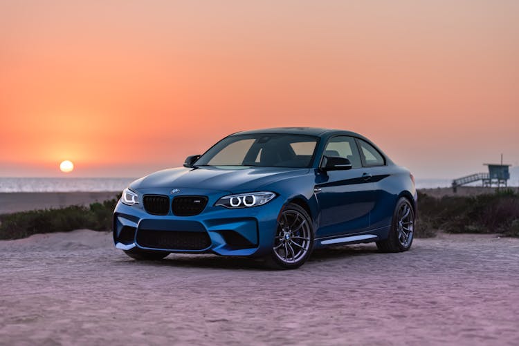 Blue BMW Sports Car Parked Near The Beach