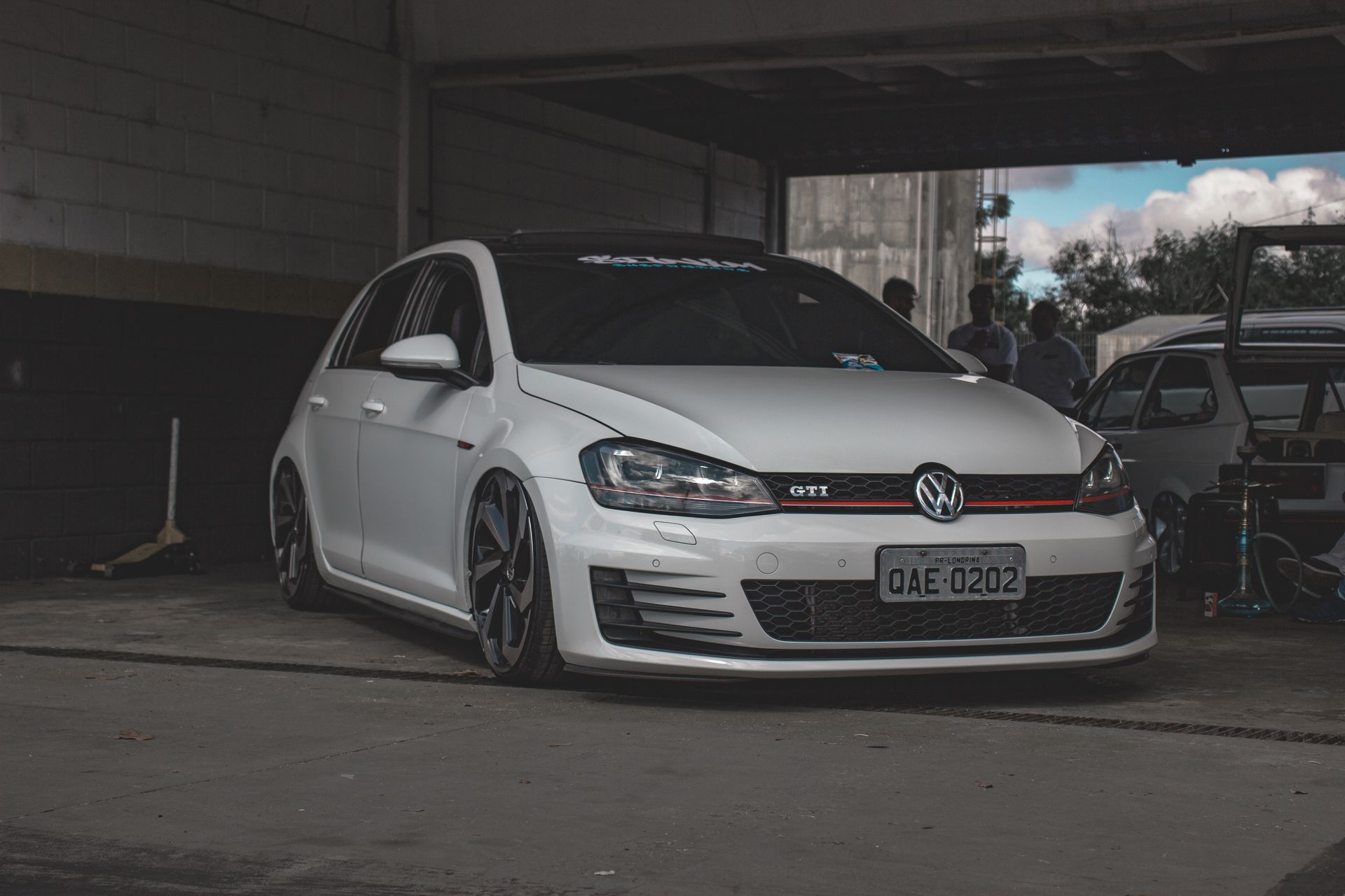 White Volkswagen Hatchback Parked in the Garage