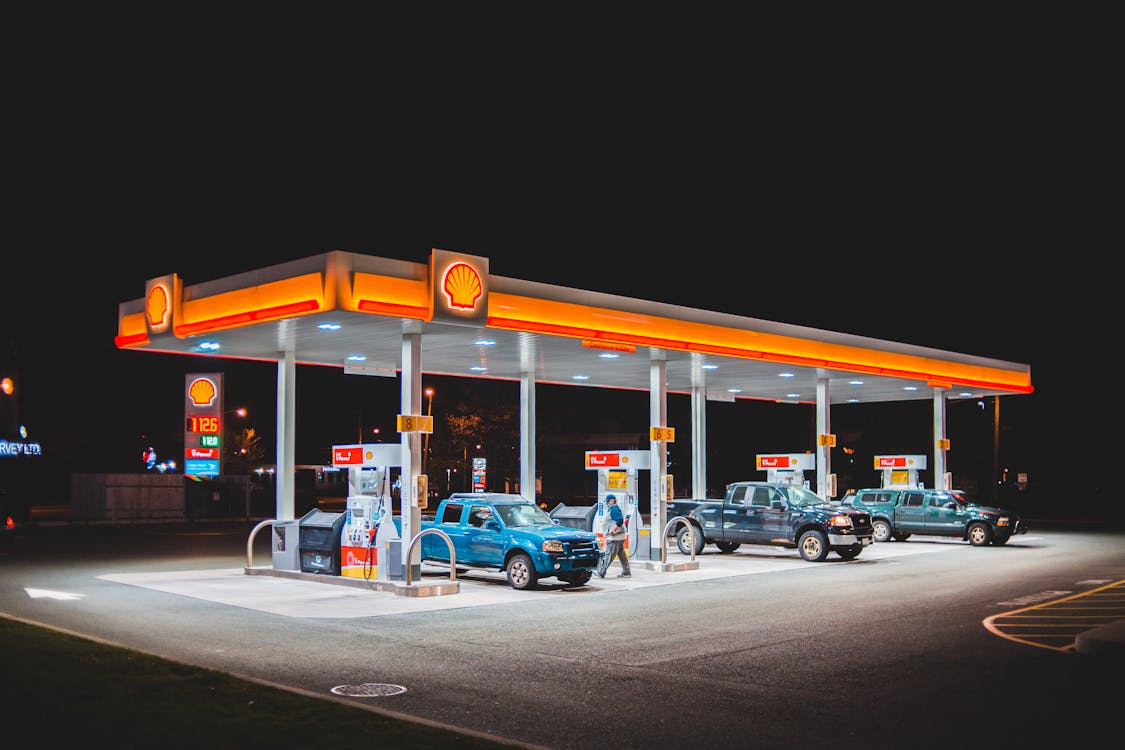 Free Cars refueling on gas station Stock Photo