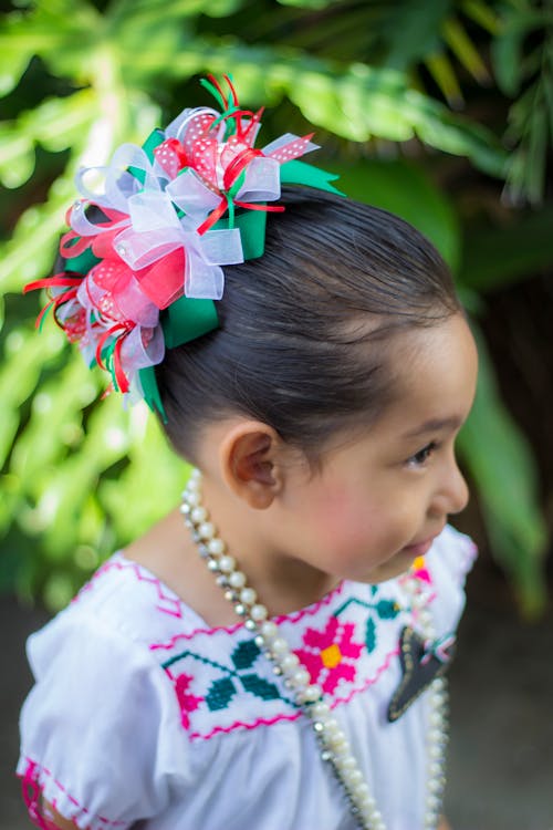 Photograph of a Child with Ribbons on Her Hair