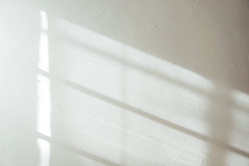 White wall with sunlight and shadow