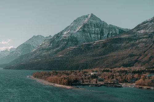 Free Breathtaking autumn view of Waterton Lakes National Park with mountains, forest, and beach. Stock Photo