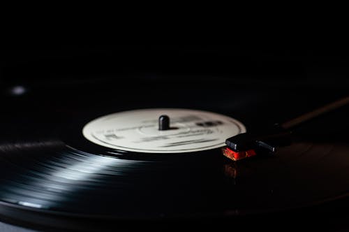Free Vinyl Record on Vinyl Record Player Stock Photo