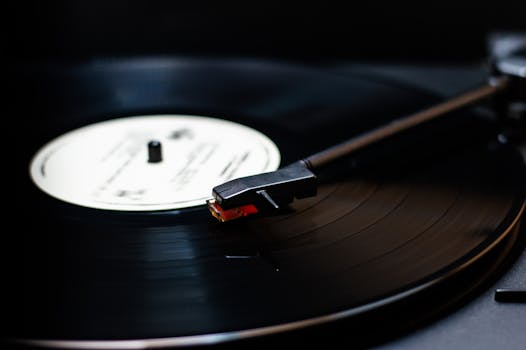 Detailed close-up of a classic vinyl record player spinning a vintage record, emphasizing warm sound.