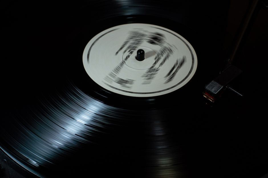 Close-up of a vintage vinyl record spinning on a turntable