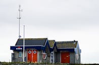 Red and Blue House Under White Sky