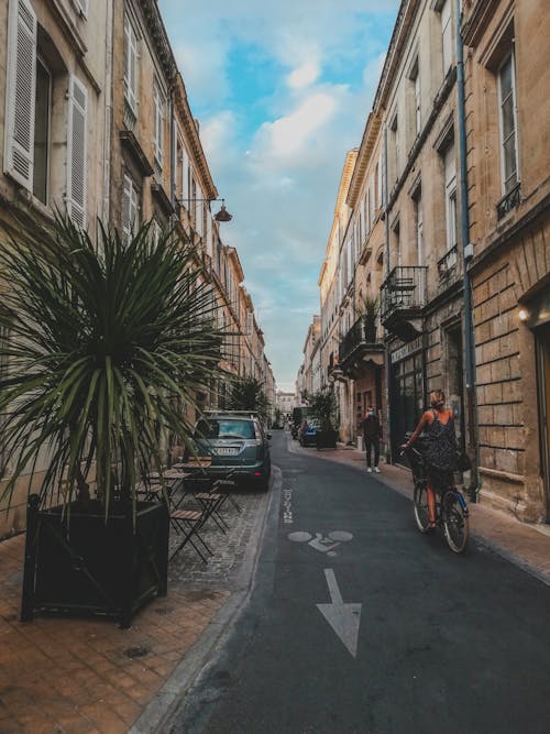 Alley with Railing Beside Houses · Free Stock Photo