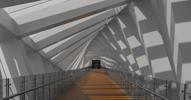 Explore a modern corridor with striking geometric designs and natural light streaming through.