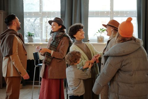 Free A warm family gathering indoors celebrating the holiday season with joy and togetherness. Stock Photo