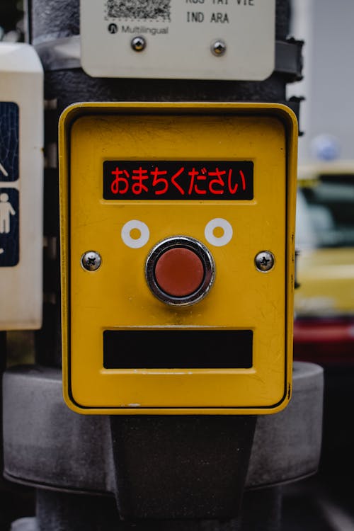 
A Close-Up Shot of a Traffic Light Button