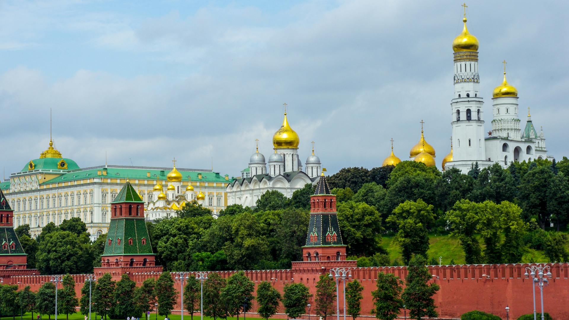 Captivating view of the iconic Moscow Kremlin and Ivan the Great Bell Tower in Russia, showcasing architectural beauty.