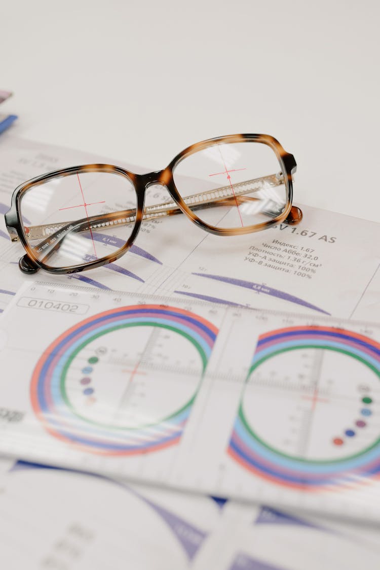 Lens Ruler On Paper With Contemporary Glasses On Table