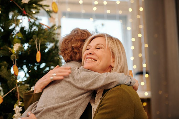 Shallow Focus Of A Grandmother Hugging Her Grandson