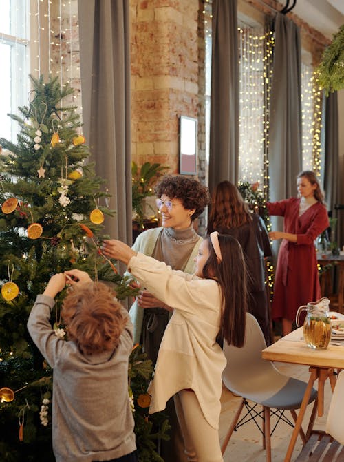 Family Decorating a Christmas Tree