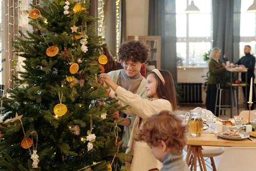 Family Decorating a Christmas Tree